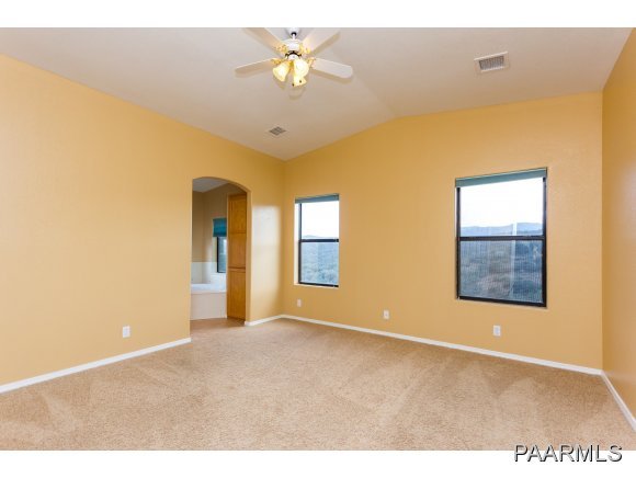 11801 Henderson Road Dewey-Humboldt, AZ 86327 - Photo 7 of 19 a view of an empty room with a window