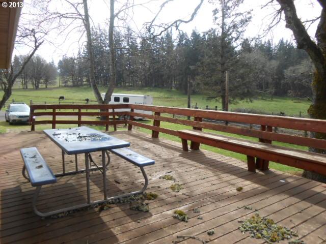 12015 South Fox Road Molalla, OR 97038 - Photo 9 of 16 a view of a bench in a backyard