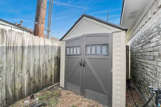 an aerial view of a house with a garden and plants