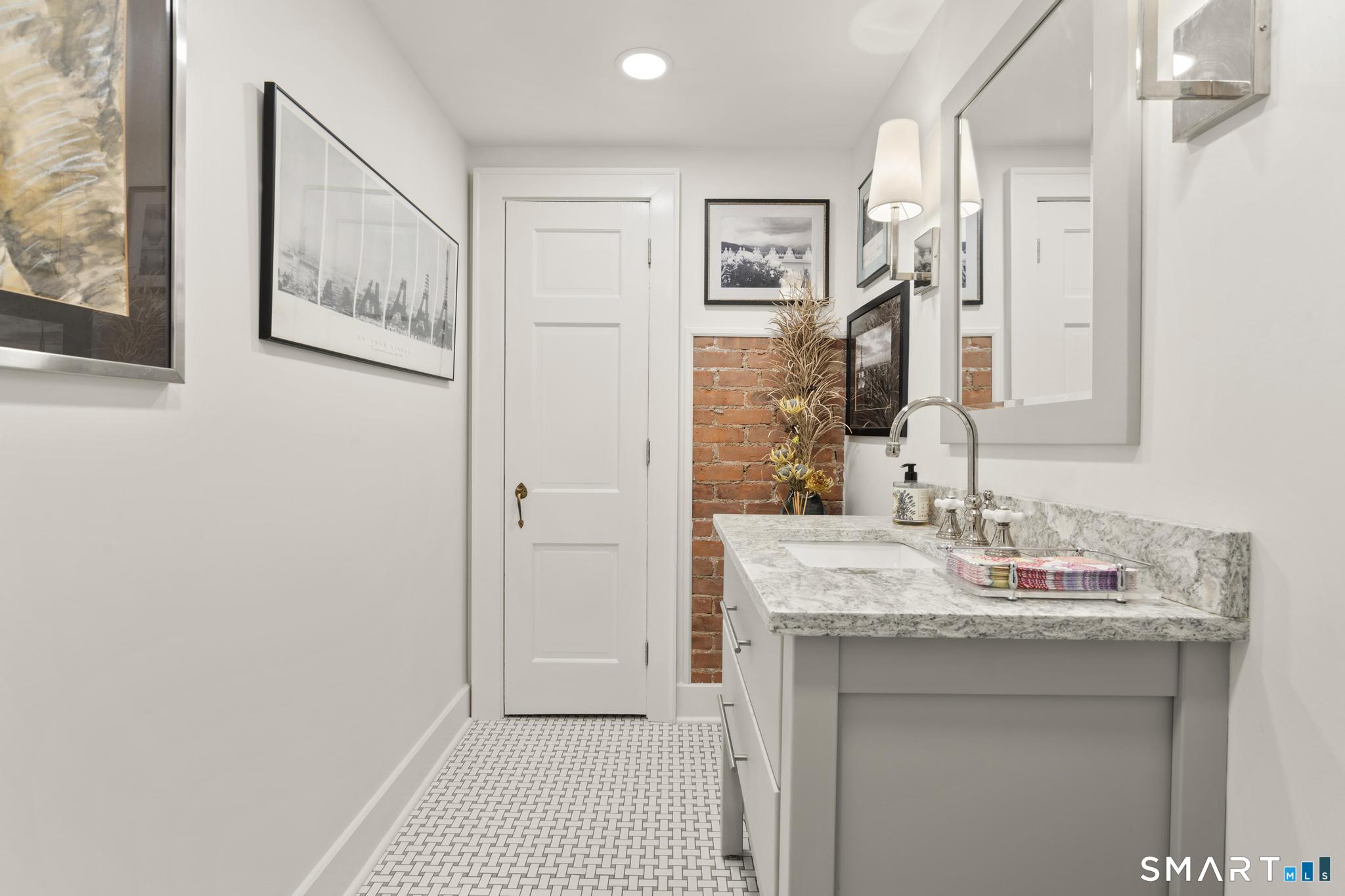 394 Wakeman Road Fairfield, CT 06824 - Photo 11 of 40 Recently installed Powder Room with exposed brick wall.