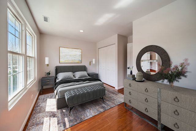 2414 West Harrison Street, Unit E Chicago, IL 60612 - Photo 13 of 37 a bedroom with a bed and a large window