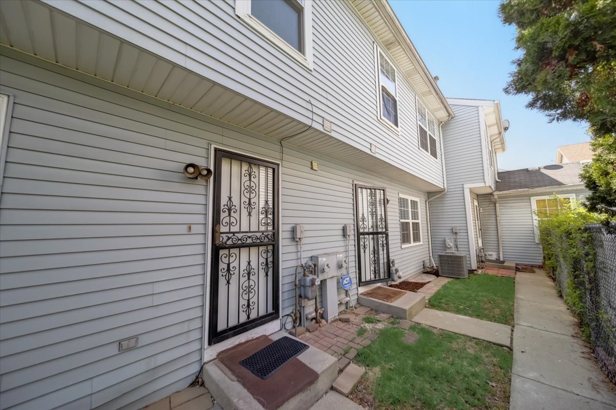 2414 West Harrison Street, Unit E Chicago, IL 60612 - Photo 35 of 37 a view of a house with a yard and sitting area
