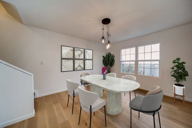 2414 West Harrison Street, Unit E Chicago, IL 60612 - Photo 7 of 37 a view of a dining room with furniture window and wooden floor