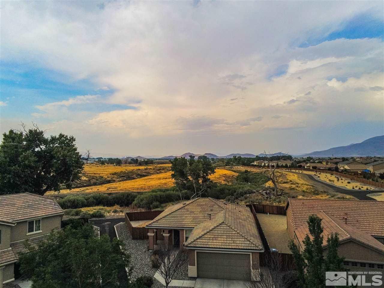 11435 Rivolli Court Reno, NV 89521 - Photo 3 of 23 an aerial view of residential houses with outdoor space