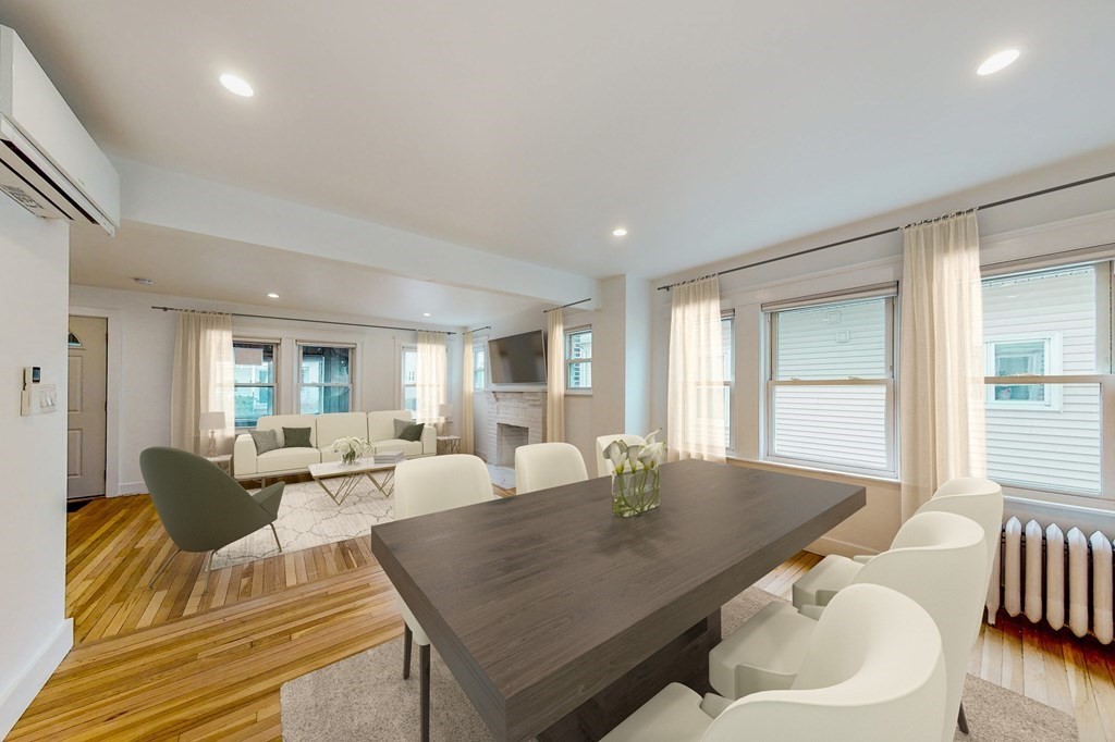 14 Olney Street, Unit 1 Watertown, MA 02472 - Photo 3 of 13 a living room with furniture and wooden floor