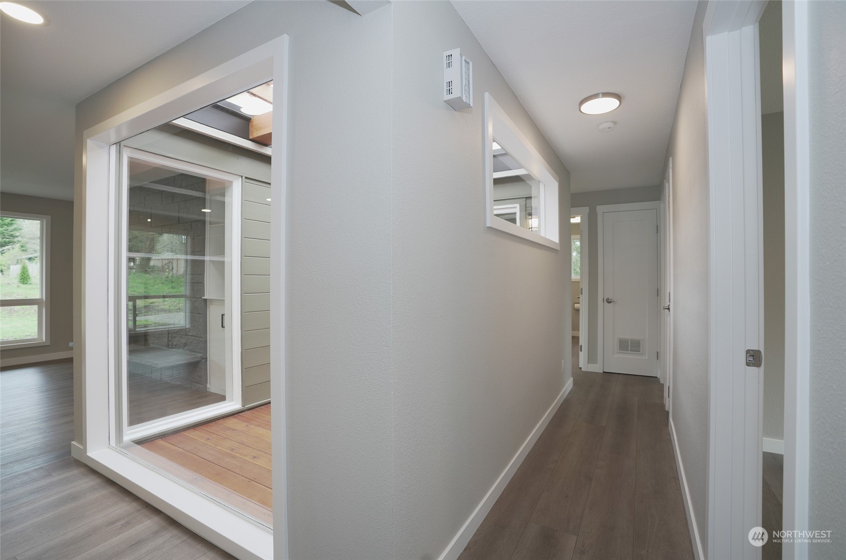 11012 Military Road Southwest Lakewood, WA 98498 - Photo 19 of 34 a view of a hallway with wooden floor and entryway