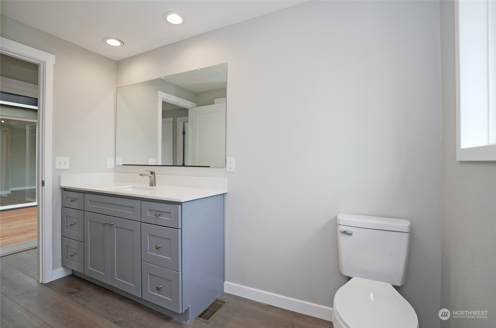 11012 Military Road Southwest Lakewood, WA 98498 - Photo 21 of 34 a bathroom with a toilet sink and mirror