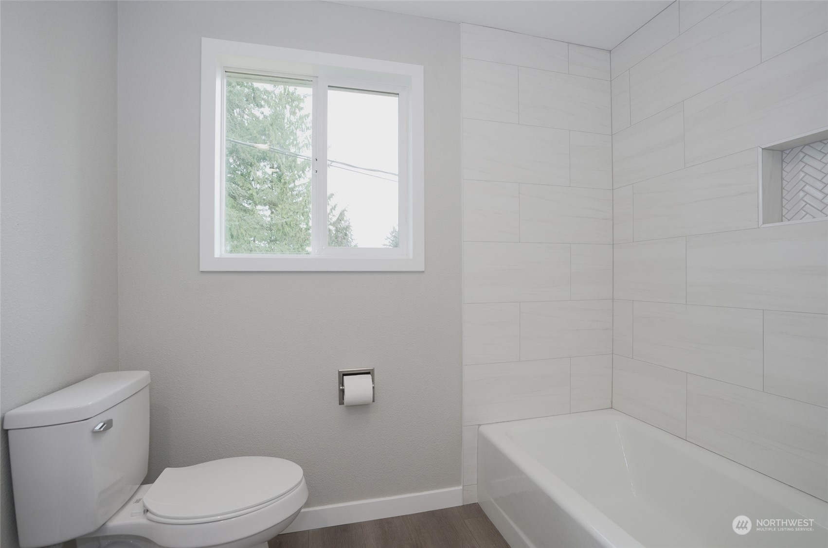 11012 Military Road Southwest Lakewood, WA 98498 - Photo 22 of 34 a white toilet sitting next to a bath tub