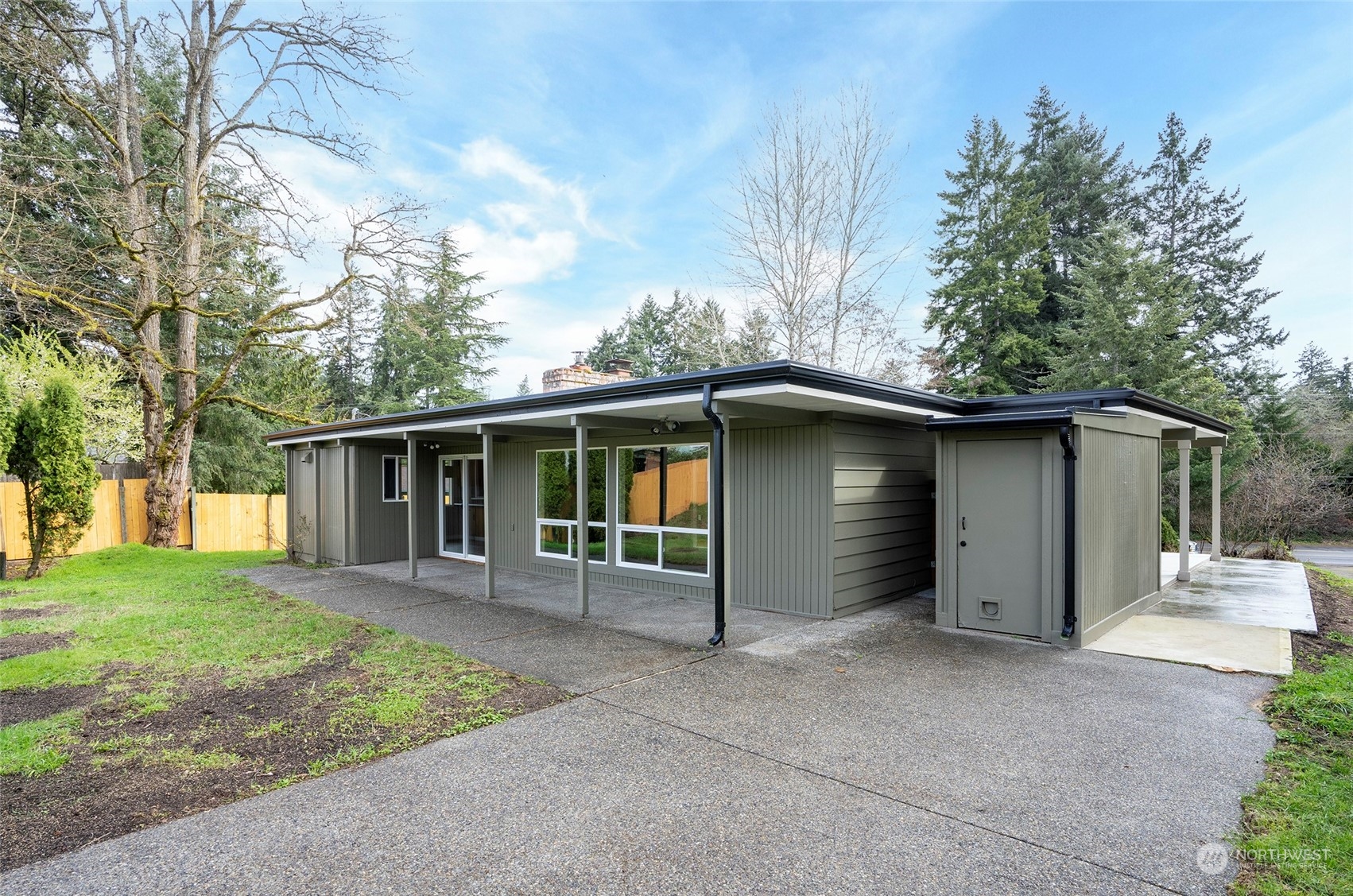 11012 Military Road Southwest Lakewood, WA 98498 - Photo 29 of 34 front view of house with a yard and trees all around