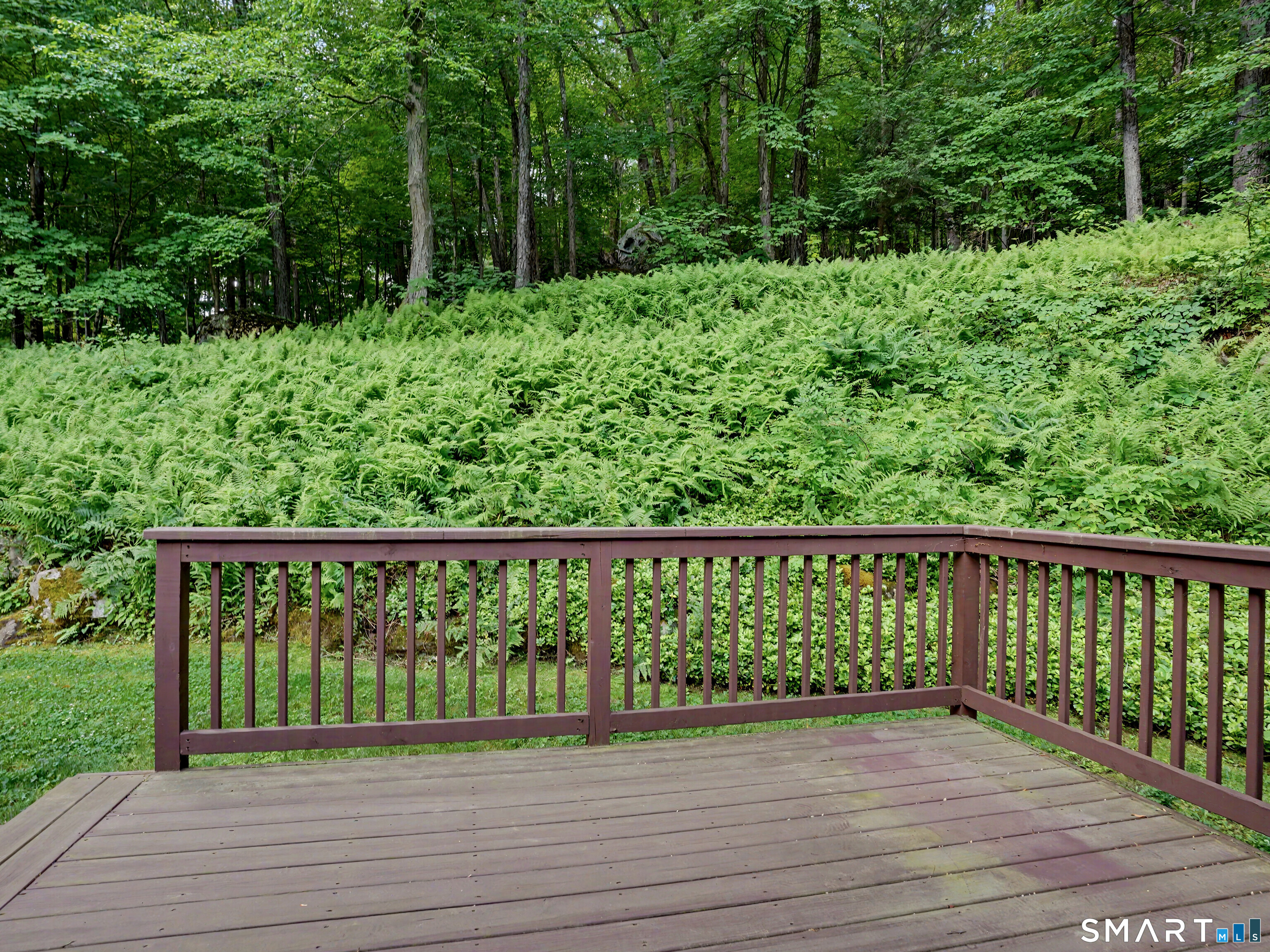 252 Bennetts Farm Road Ridgefield, CT 06877 - Photo 26 of 40 Enjoy the truly magical, private setting, bordered by open space & complete with two decks perfect for relaxation or entertaining.