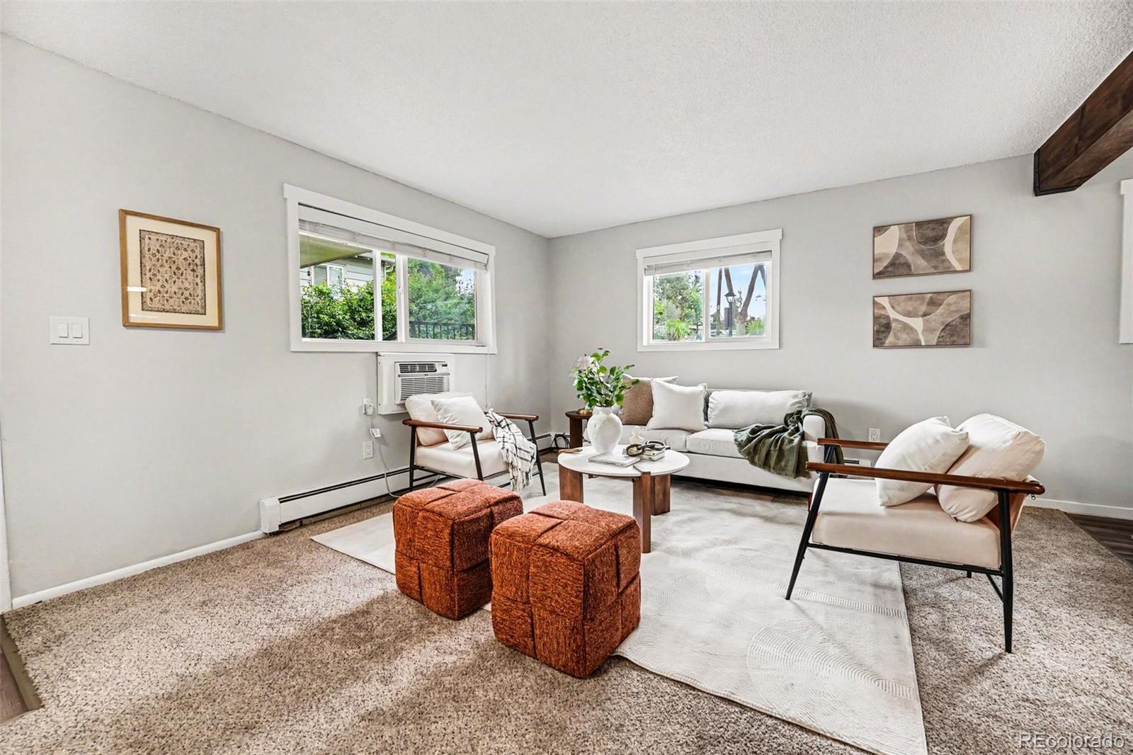 5700 West 28th Avenue, Unit 1 Wheat Ridge, CO 80214 - Photo 15 of 25 a living room with furniture and a window