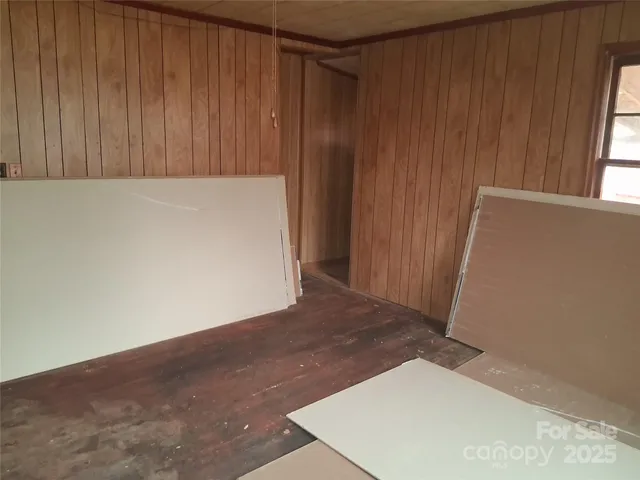 an empty room with wooden floor