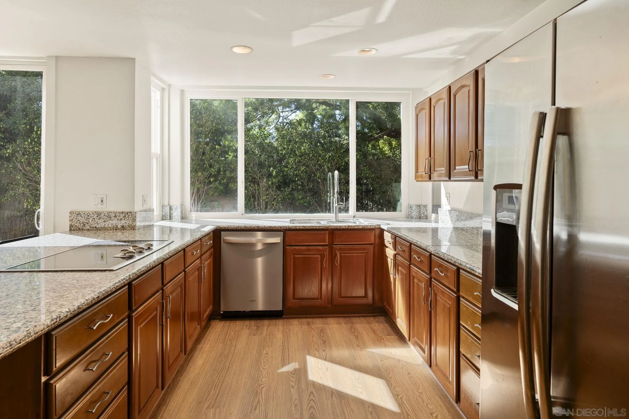 2847 Via Posada La Jolla, CA 92037 - Photo 12 of 21 a kitchen with stainless steel appliances granite countertop a sink a stove and a refrigerator