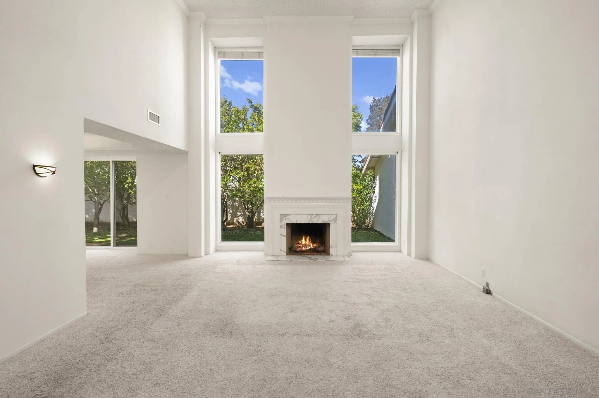 2847 Via Posada La Jolla, CA 92037 - Photo 6 of 21 a view of a livingroom with a fireplace and window
