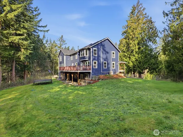 a view of a house with a big yard