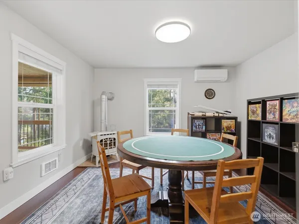 a view of a dining room with furniture and window