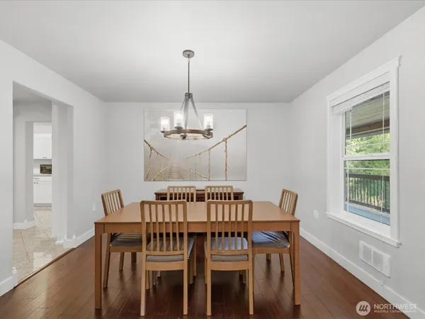 a view of a dining room with furniture window and wooden floor
