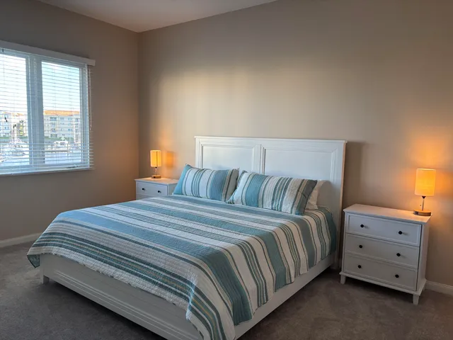 a bedroom with a bed and a dresser