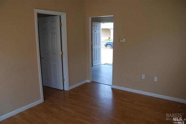 148 North 3rd Street Rio Vista, CA 94571 - Photo 5 of 11 an empty room with wooden floor and closet