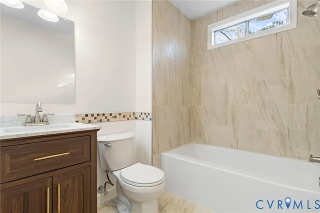 a bathroom with a sink a toilet and a bathtub