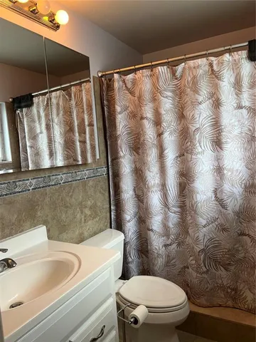 a bathroom with a toilet and a sink