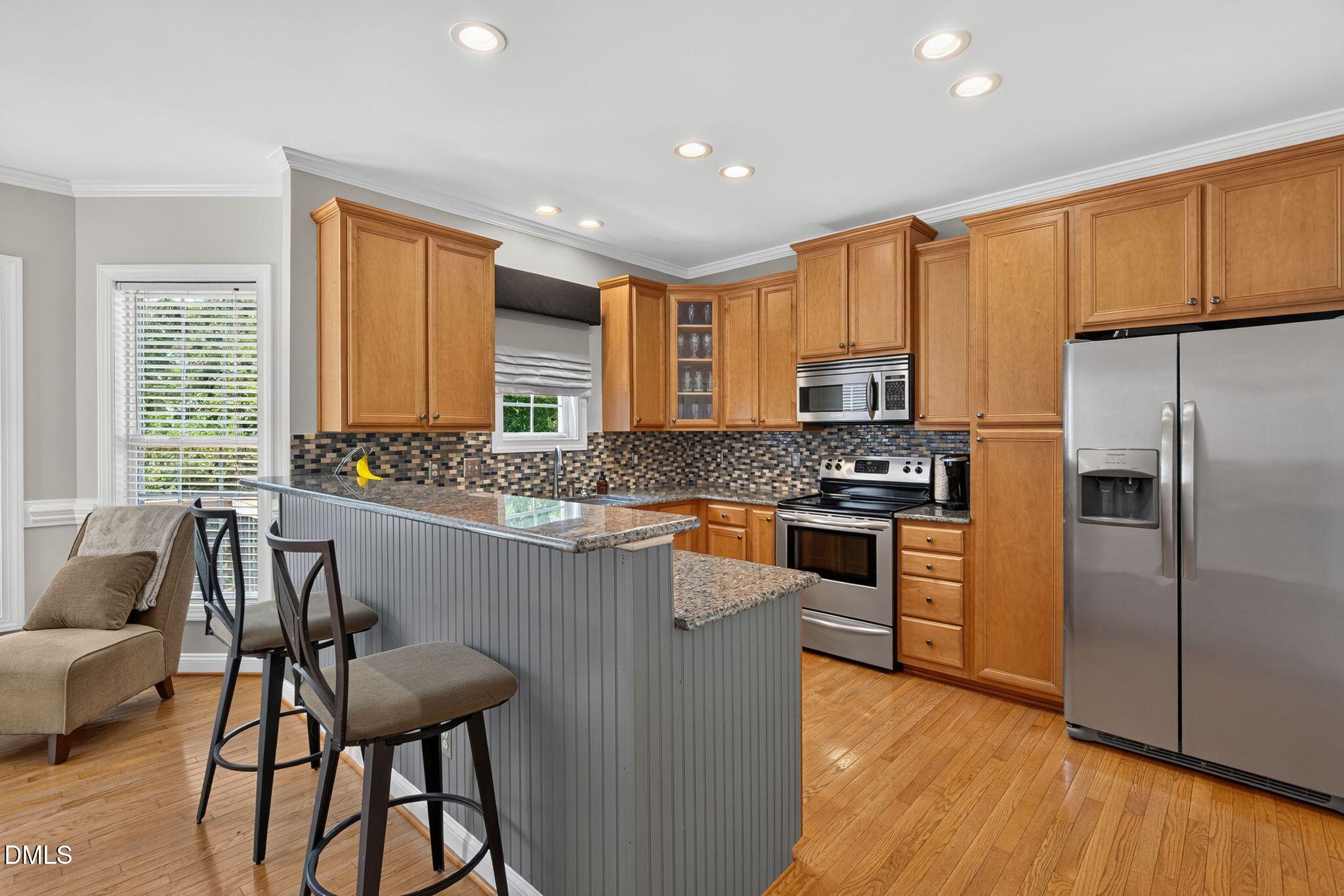 516 Deacon Ridge Street Wake Forest, NC 27587 - Photo 2 of 94 Kitchen with Breakfast Bar