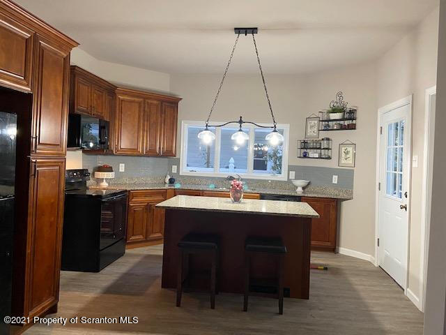 304 Main Street Scranton, PA 18507 - Photo 2 of 22 a kitchen with kitchen island a sink stove and refrigerator