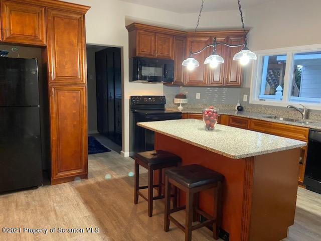 304 Main Street Scranton, PA 18507 - Photo 3 of 22 a kitchen with stainless steel appliances granite countertop a sink refrigerator and cabinets