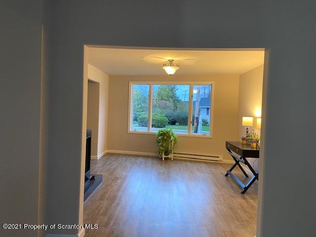 304 Main Street Scranton, PA 18507 - Photo 8 of 22 a view of an entryway with wooden floor and windows