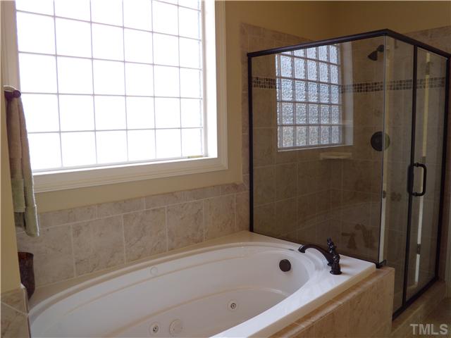 1210 Ileagnes Road Raleigh, NC 27603 - Photo 7 of 7 a bathroom with a bathtub and shower