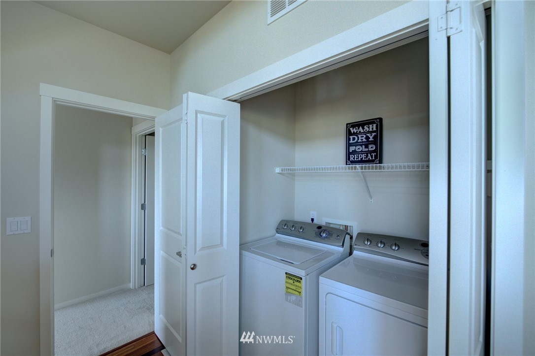 114 Cougar Ridge Road Northwest, Unit 1701 Issaquah, WA 98027 - Photo 23 of 25 a utility room with dryer and washer