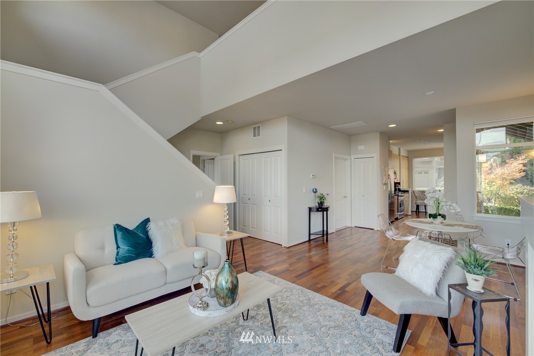 114 Cougar Ridge Road Northwest, Unit 1701 Issaquah, WA 98027 - Photo 7 of 25 a living room with furniture and a wooden floor