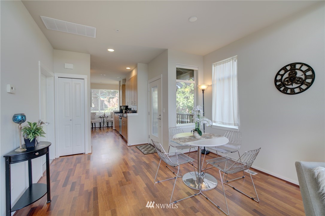 114 Cougar Ridge Road Northwest, Unit 1701 Issaquah, WA 98027 - Photo 8 of 25 a view of a room with furniture and wooden floor