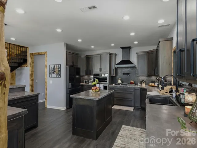 a kitchen with a sink stove and refrigerator
