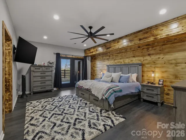 a bed room with a bed and a television