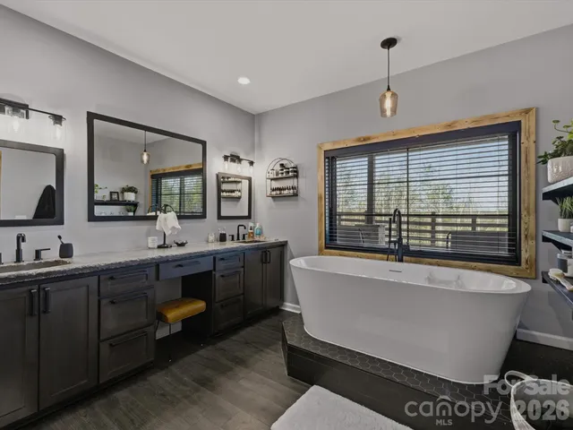 a spacious bathroom with a tub and sink