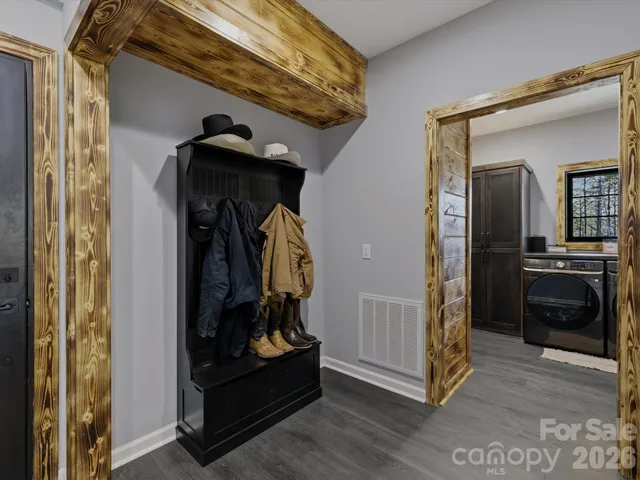 a bathroom with a granite countertop toilet sink and mirror