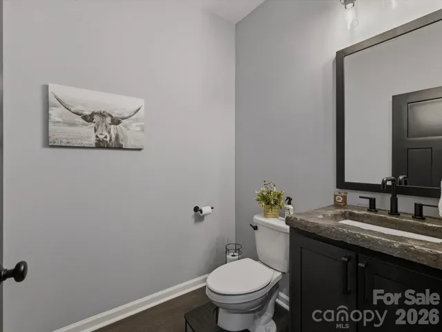 a living room with lots of furniture and kitchen view