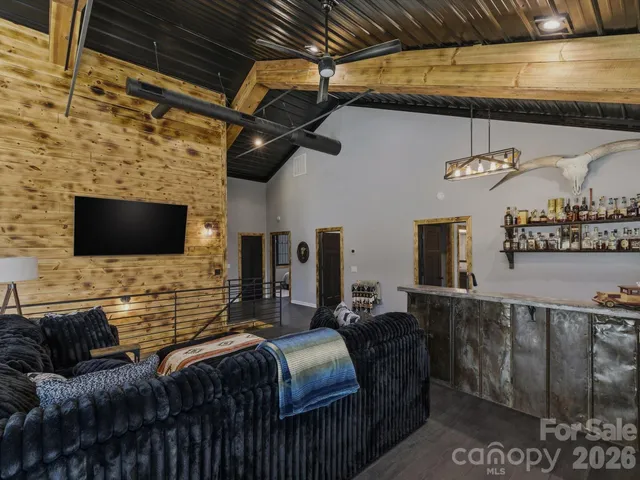 a en suite bathroom with a granite countertop sink and a mirror