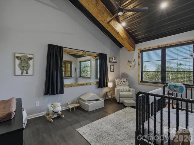 a view of parking garage with cars parked