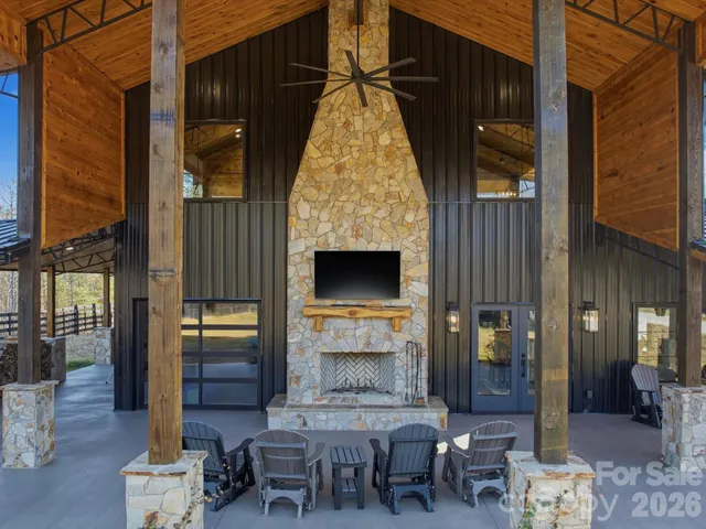 a view of hall way with furniture and chandelier