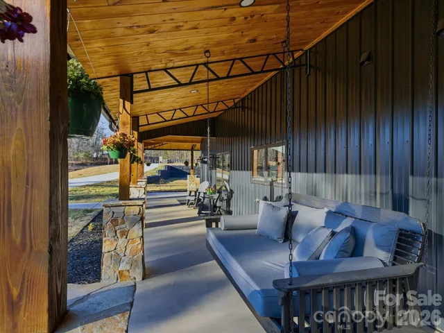 a view of a patio with table and chairs with wooden floor