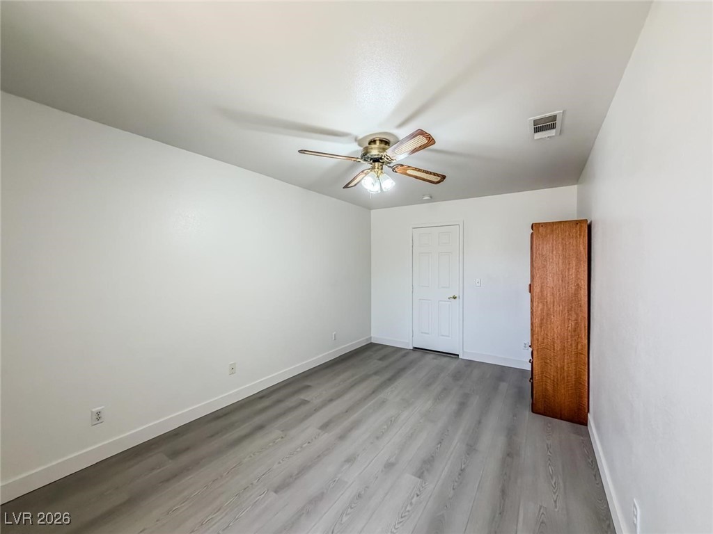 5308 Scoreboard Street Las Vegas, NV 89130 - Photo 11 of 32 Unfurnished bedroom with ceiling fan and light wood-type flooring