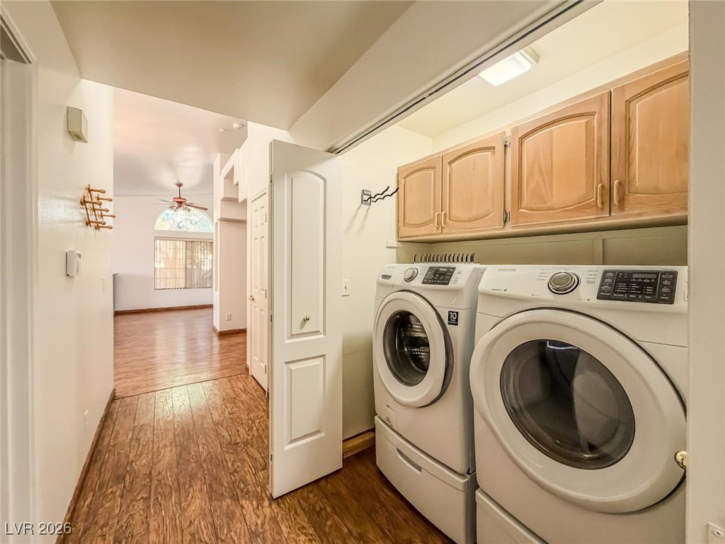 5308 Scoreboard Street Las Vegas, NV 89130 - Photo 14 of 32 Laundry room with cabinet space, dark wood-style floors, independent washer and dryer, and a ceiling fan