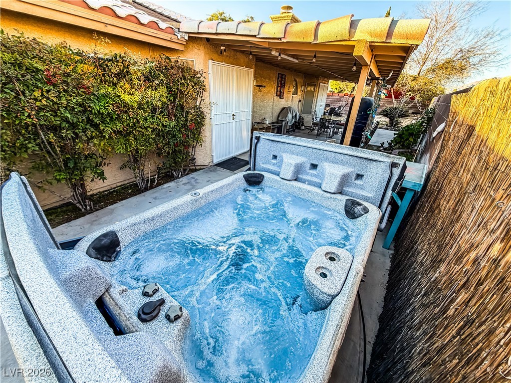 5308 Scoreboard Street Las Vegas, NV 89130 - Photo 2 of 32 View of pool featuring a hot tub and patio surround