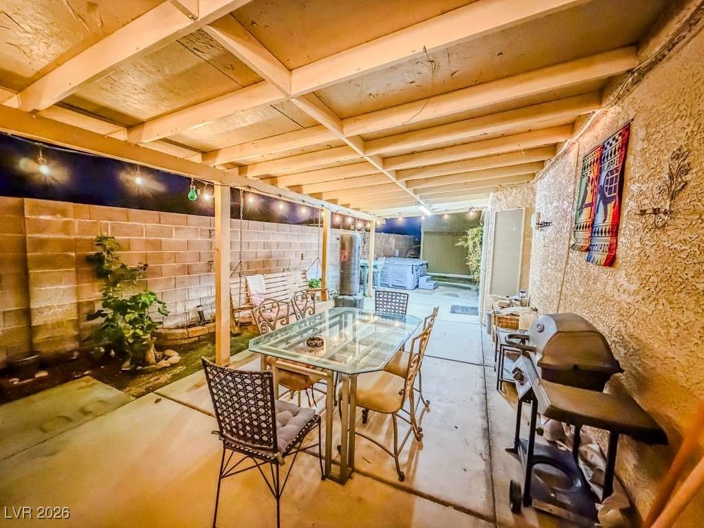 5308 Scoreboard Street Las Vegas, NV 89130 - Photo 8 of 32 Fenced backyard with grilling area, outdoor dining area, and a patio