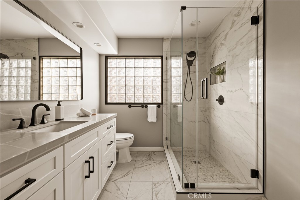 1819 Richard Street Burbank, CA 91504 - Photo 14 of 29 a bathroom with a granite countertop sink a toilet and shower