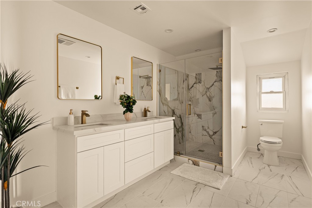 1819 Richard Street Burbank, CA 91504 - Photo 19 of 29 a spacious bathroom with a shower sink and mirror