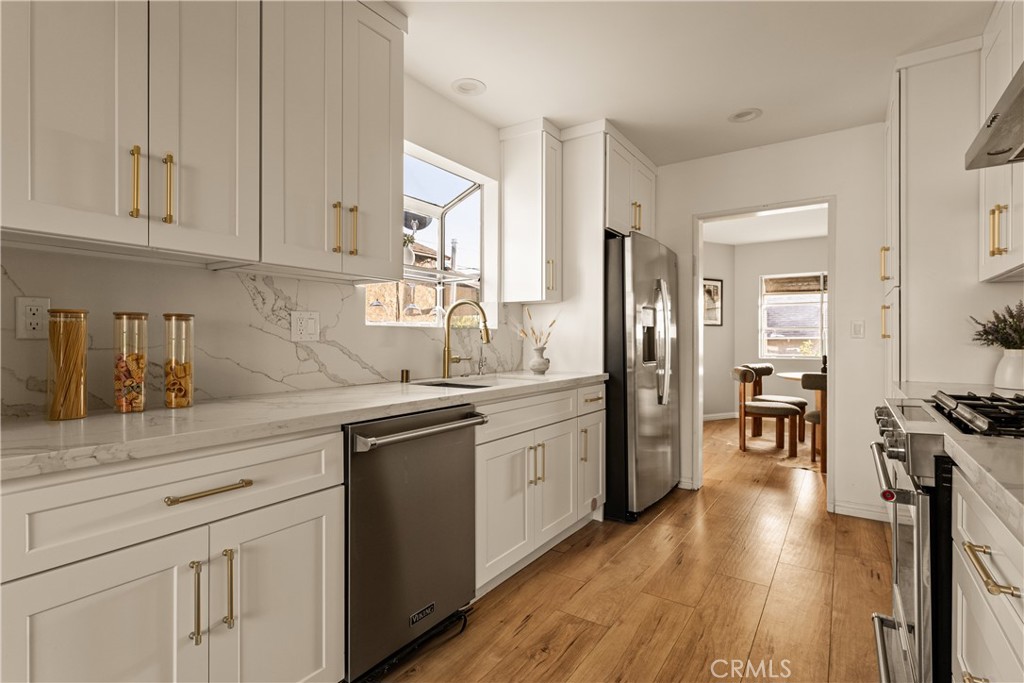 1819 Richard Street Burbank, CA 91504 - Photo 10 of 29 a kitchen with white cabinets and sink