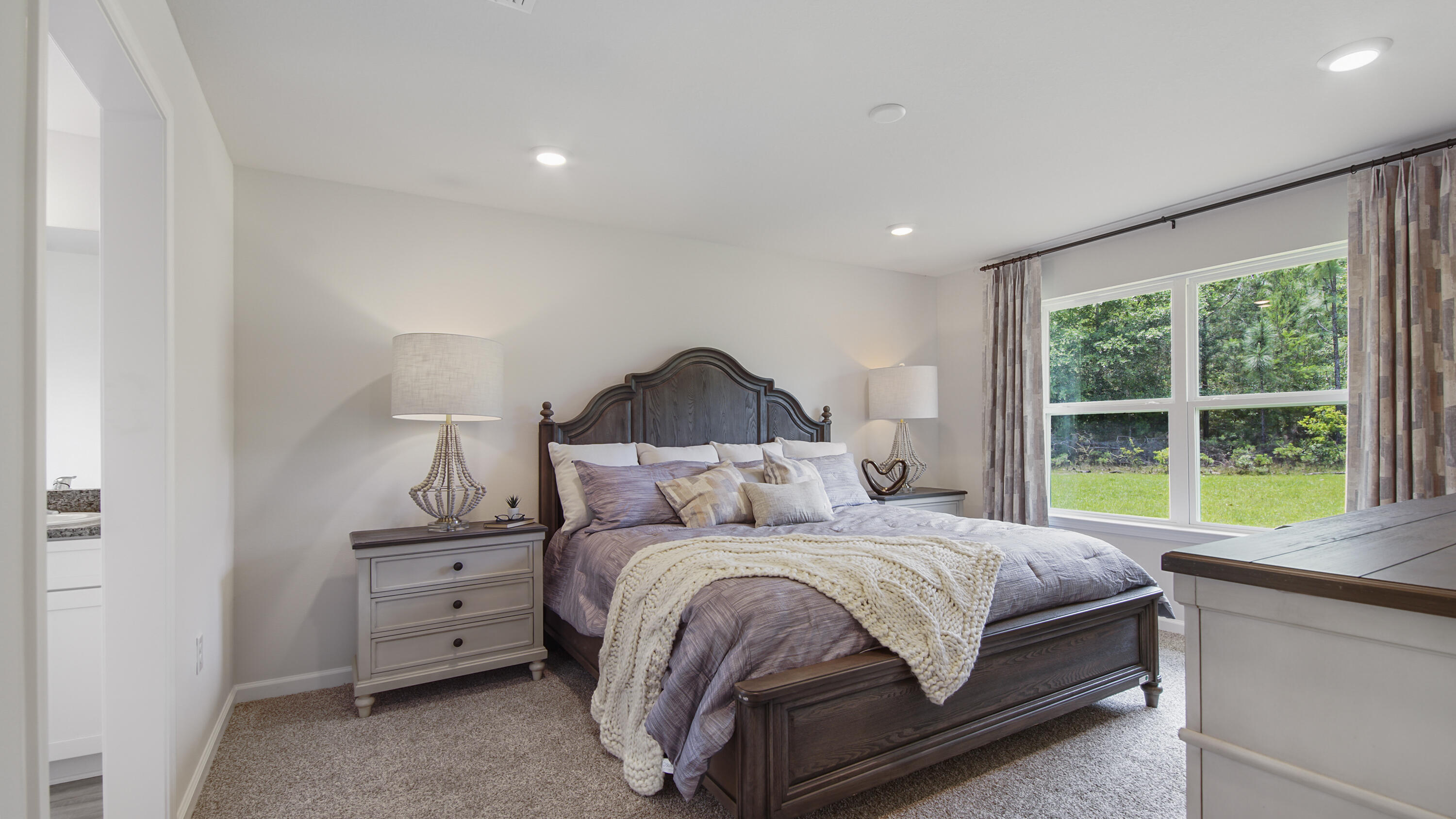 203 Eunola Lane Freeport, FL 32439 - Photo 13 of 38 a bedroom with a bed and a large window